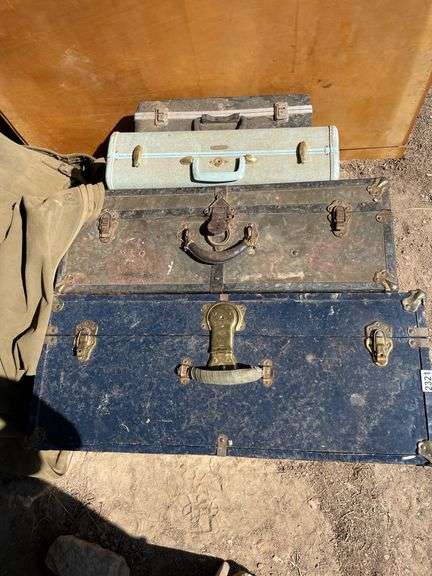 Two trunks a suitcase, and a briefcase