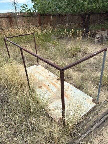 Metal door with steel railing welded to it.