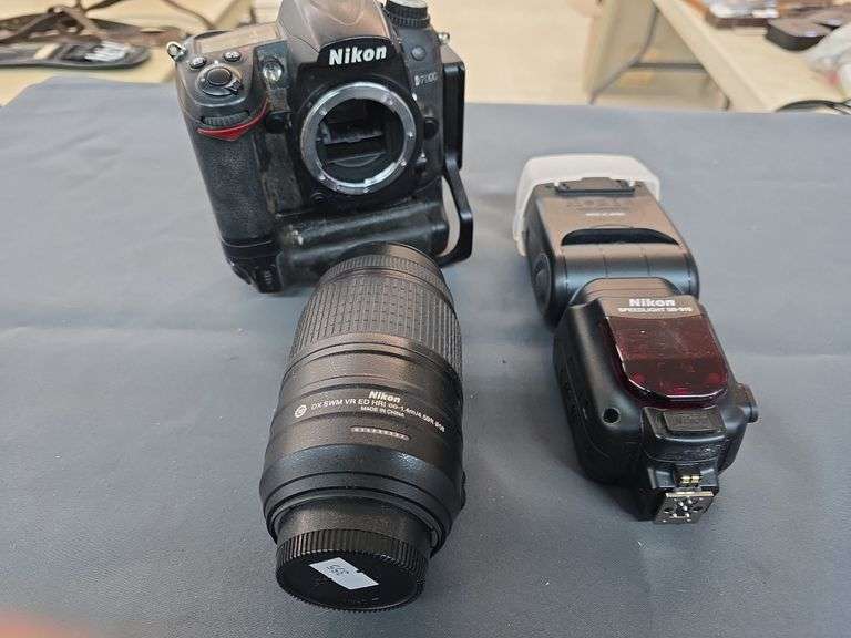 Nikon camera with lens and flasher image