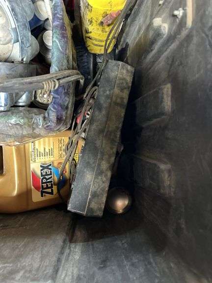 Tough box containing miscellaneous automotive fluids, and tools