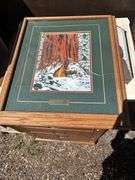 Wooden Desk with Print and Miscellaneous Items