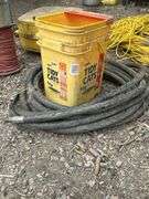 Hydraulic hose, spool of wire, and bucket of miscellaneous