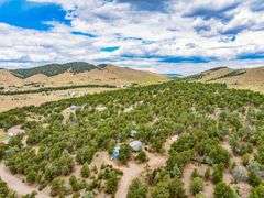 Colorado Mountain Property Auction • 5± (Two- 2.5 acres tracts)1 with Mobile Home and improvements, 1 land only