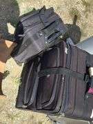 Two Black Rolling Suitcases