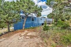 Colorado Mountain Property Auction • 5± (Two- 2.5 acres tracts)1 with Mobile Home and improvements, 1 land only