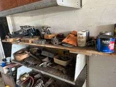 Four shelves of miscellaneous hardware, tools, and scrap metal