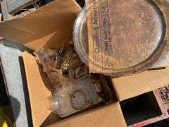 Red metal box containing a box of vintage dishes