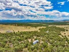 Colorado Mountain Property Auction • 5± (Two- 2.5 acres tracts)1 with Mobile Home and improvements, 1 land only