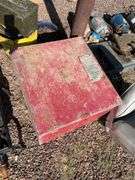 Red metal box containing a box of vintage dishes