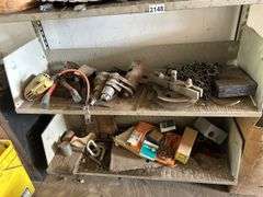Four shelves of miscellaneous hardware, tools, and scrap metal