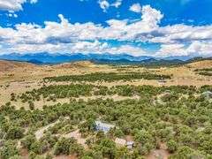 Colorado Mountain Property Auction • 5± (Two- 2.5 acres tracts)1 with Mobile Home and improvements, 1 land only