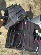 Two Black Rolling Suitcases
