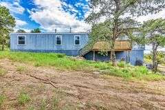 Colorado Mountain Property Auction • 5± (Two- 2.5 acres tracts)1 with Mobile Home and improvements, 1 land only