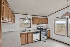 Colorado Mountain Property Auction • 5± (Two- 2.5 acres tracts)1 with Mobile Home and improvements, 1 land only