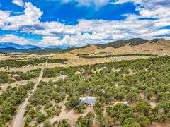 Colorado Mountain Property Auction • 5± (Two- 2.5 acres tracts)1 with Mobile Home and improvements, 1 land only