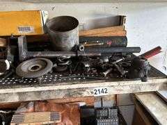 Four shelves of miscellaneous hardware and tools