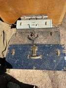 Two trunks a suitcase, and a briefcase