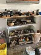 Four shelves of miscellaneous hardware, tools, and scrap metal