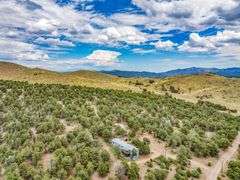 Colorado Mountain Property Auction • 5± (Two- 2.5 acres tracts)1 with Mobile Home and improvements, 1 land only