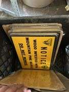 Crate of license plates, small Signs and gas pump handle