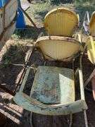 Three yellow metal patio chairs