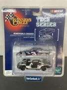NASCAR Winner's Circle Tech Series 1:64 scale die-cast car featuring Dale Earnhardt Jr.'s #3 AC Delco Chevrolet Monte Carlo with a removable chassis.