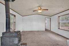Colorado Mountain Property Auction • 5± (Two- 2.5 acres tracts)1 with Mobile Home and improvements, 1 land only
