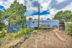 Colorado Mountain Property Auction • 5± (Two- 2.5 acres tracts)1 with Mobile Home and improvements, 1 land only