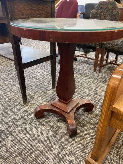Round wooden table with glass top image