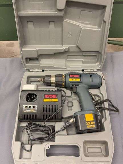 Ryobi 12V cordless drill with batter and charger image