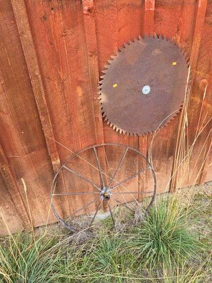 Antique Saw Blade and Wagon Wheel image