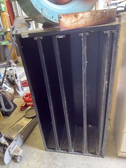 Black metal shelving unit with roll out shelves image