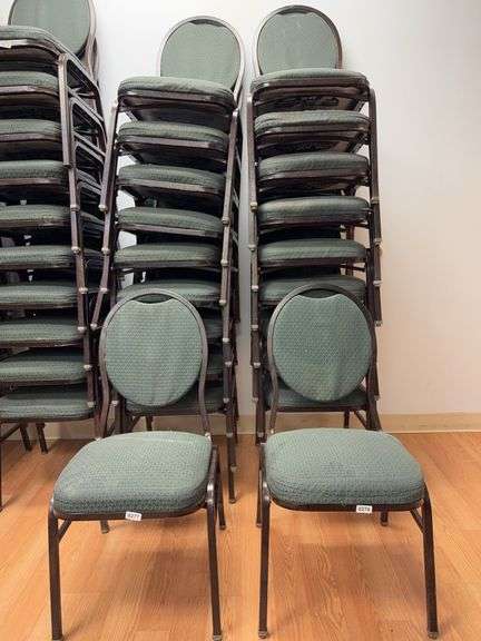 Event center chairs stack of 10 (bronze colored frame green Cushions image