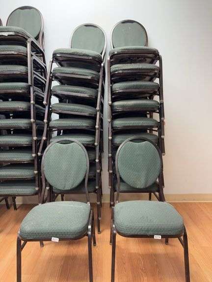 Event center chairs stack of 10 (bronze colored frame green Cushions image