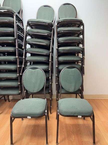 Event center chairs stack of 10 (bronze colored frame green Cushions image