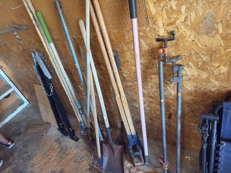 Assorted yard tools/pipe clamps image