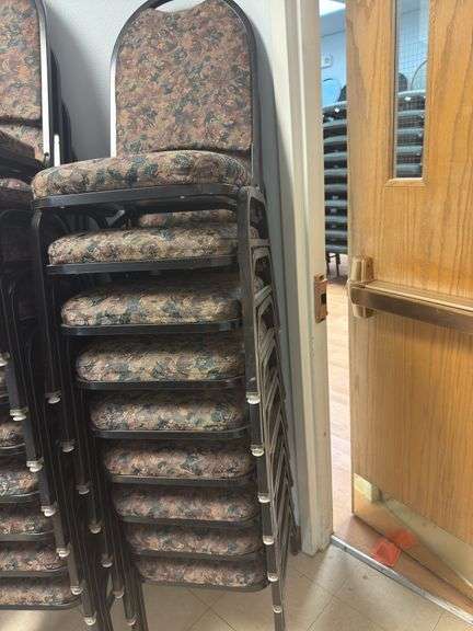 Event chairs, black frames with bronze floral pattern stack of 9. image