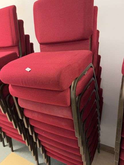 Stack of 10 event center chairs red cushions image