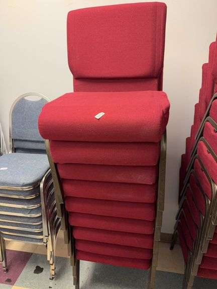 Stack of 10 event center chairs red cushions image