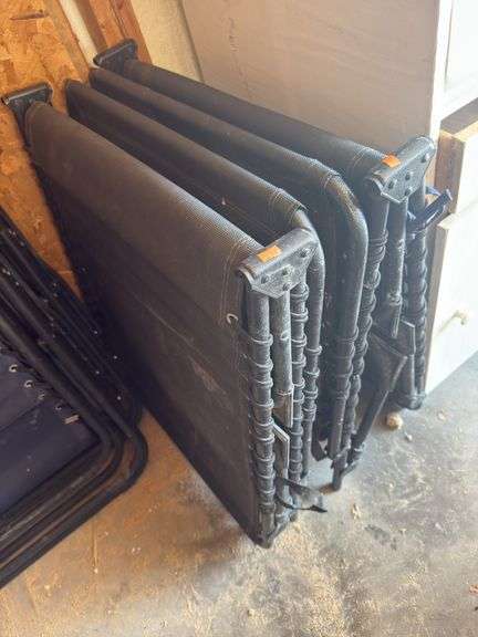 Two black folding lounge chairs image