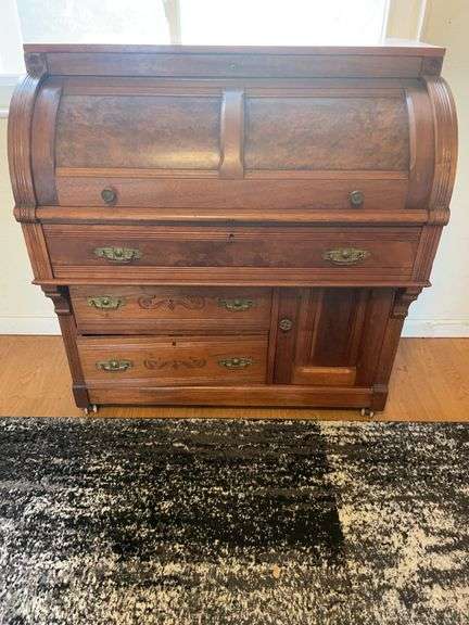 Antique roll top desk has had some repair image