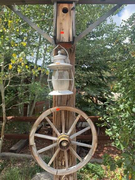 Wood wagon wheel, yard light, birdhouse image