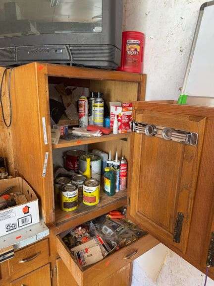 Contents of the two shelves the drawer and the TV comes with it image