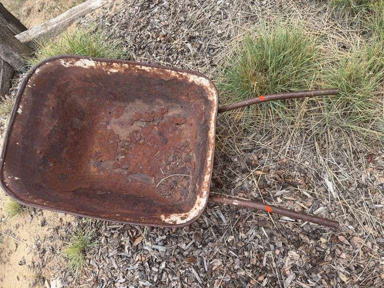 Antique metal wheel barrow image