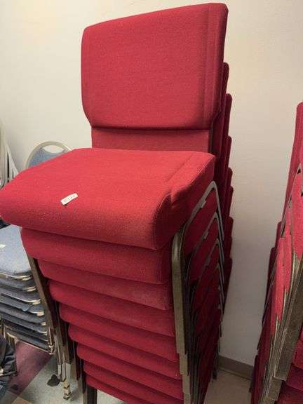 Stack of 9 event center chairs red cushions image