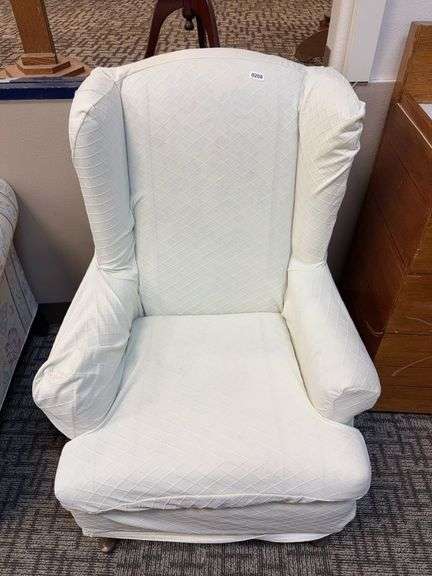 traditional upholstered wingback chair image