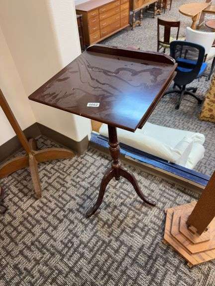 vintage wooden tilt-top tripod table. image