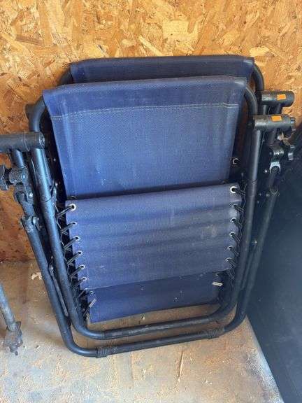 Two blue folding lounge chairs image