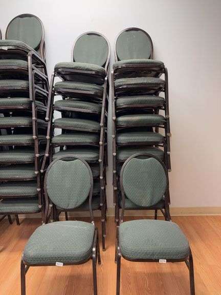 Event center chairs stack of 10 (bronze colored frame green Cushions image
