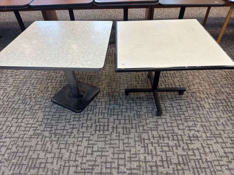 2-36x36 tables. One with casters and the other with steel base image